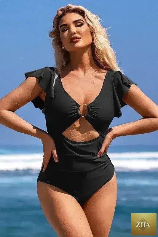 Femstylo ruffle sleeve swimsuit with O-ring cutout and tummy control, featuring stylish design and bright color.