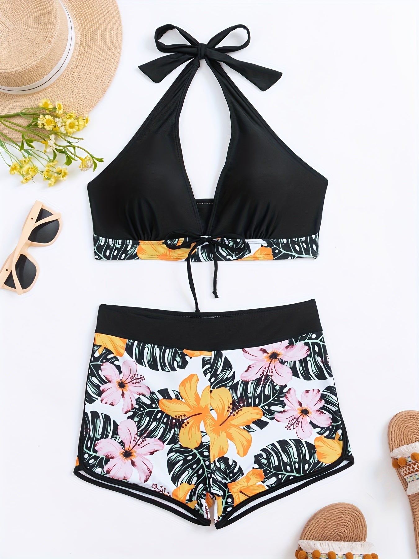 Stevvex floral halter neck 2-piece bikini set with backless design, tie-neck bow, and high waist bottoms, perfect for beach and pool.