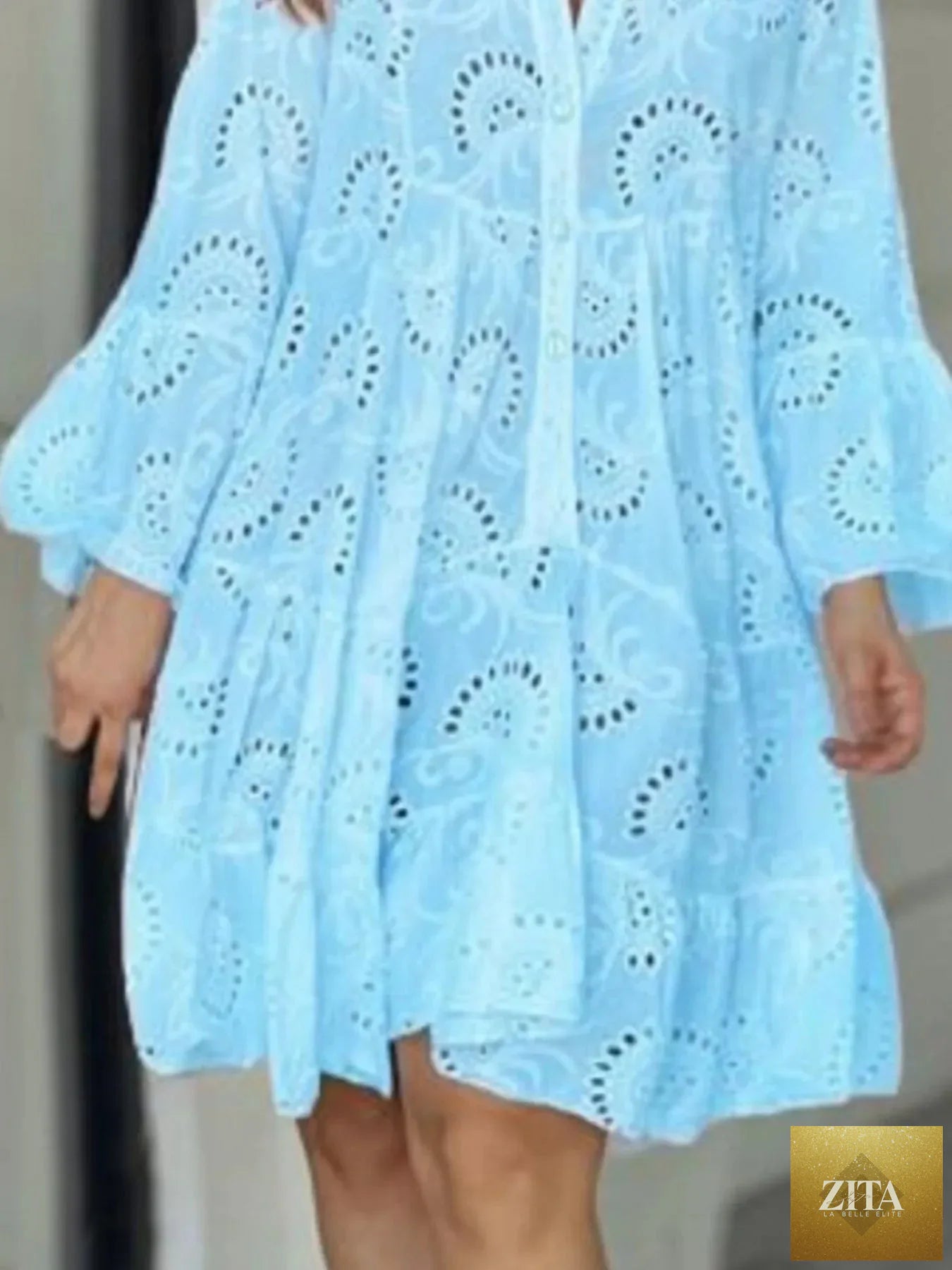 Eyelet ruffled hem tiered dress by Shopiebay, featuring layered fabric and feminine design with eyelet details and ruffled accents.