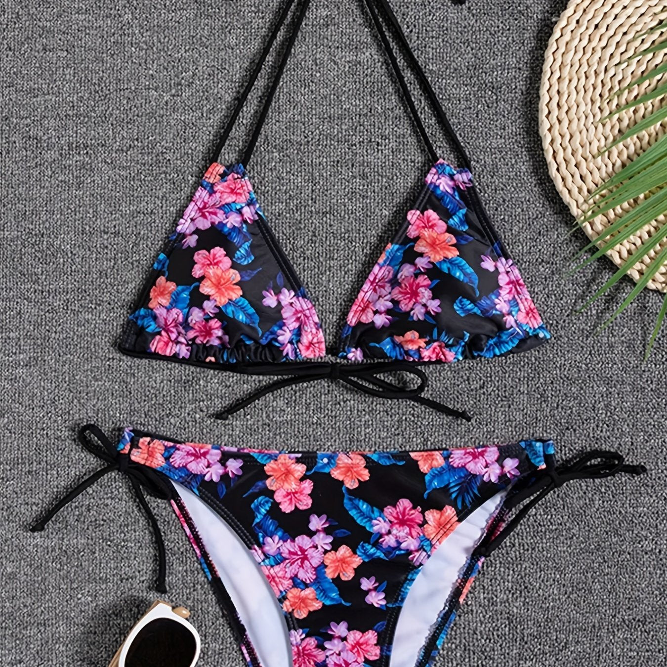 Stevvex Sunset Bloom 2-piece triangle bikini set for women with vibrant floral print, halter neck, tie-back, and high-cut bottoms.
