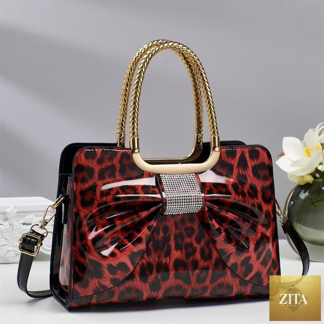 Elegant genuine leather handbag with leopard print and hot-stone embellishments, versatile chic women's bag by Social Buzz eSIMs.