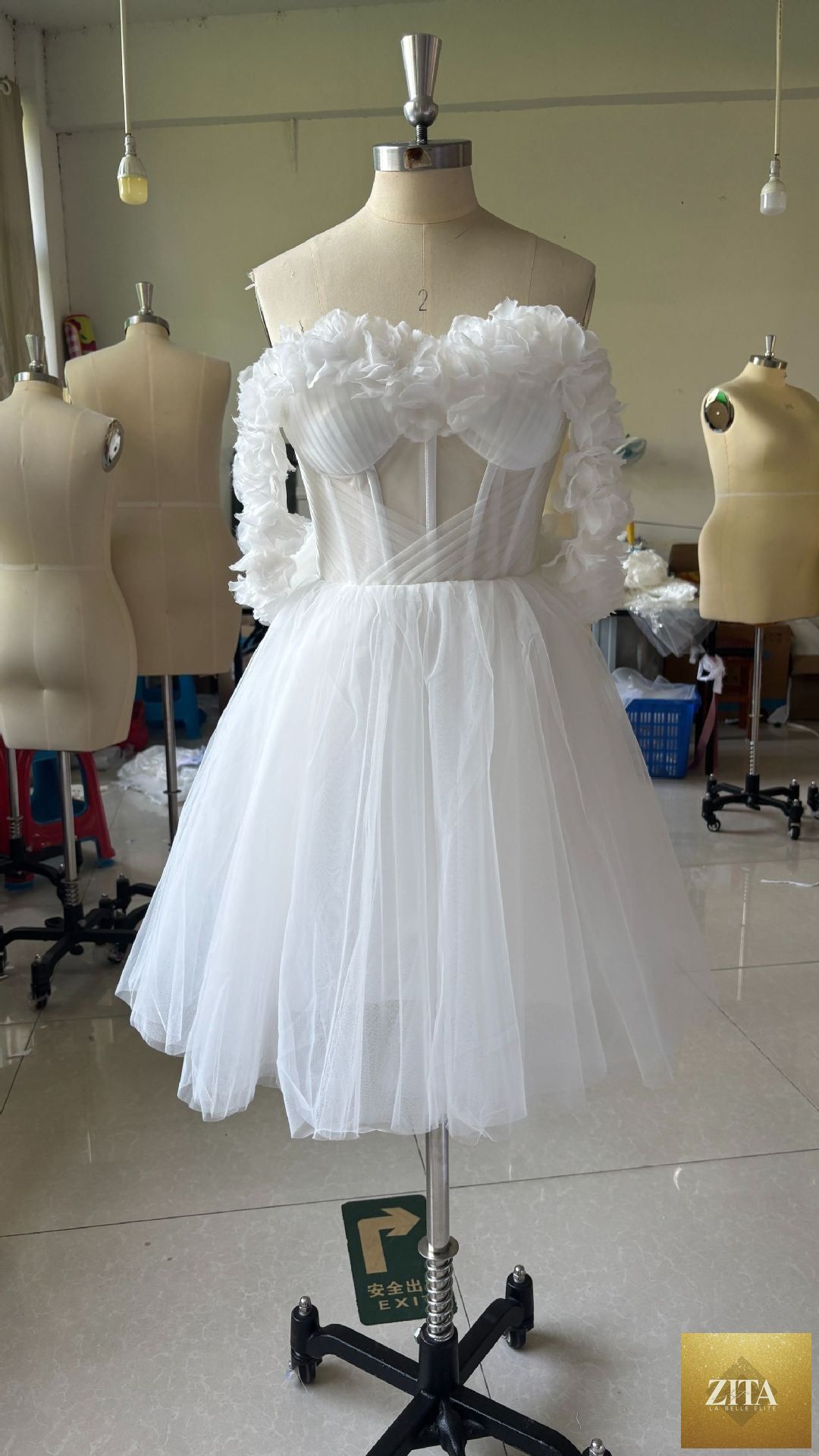 Lace off-shoulder mini wedding dress with fitted bodice and flowing skirt, elegant bridal gown for special occasions