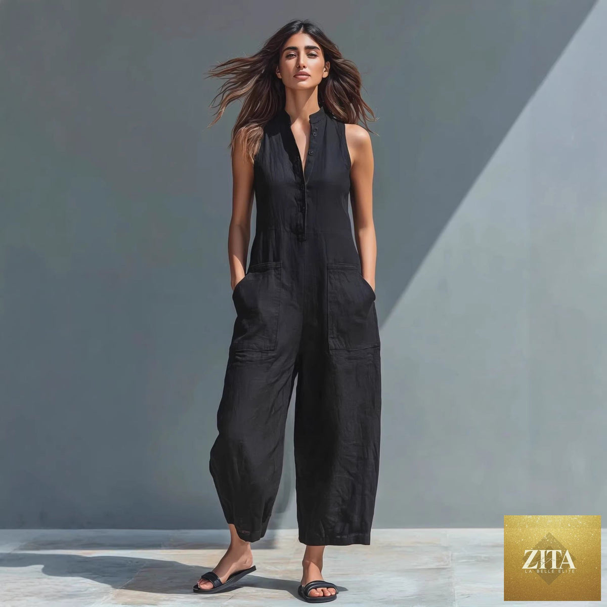 Casual women's sleeveless jumpsuit with buttoned stand collar and loose fit, from Zita La Belle Elite.