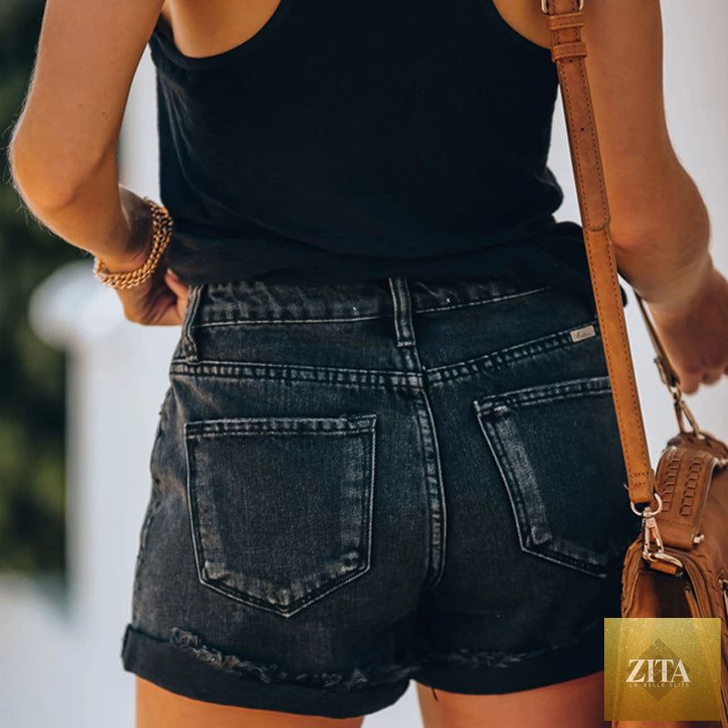 Black high-waist denim hot pants for women with high elasticity, perfect for spring and summer fashion, by Wanita Store.