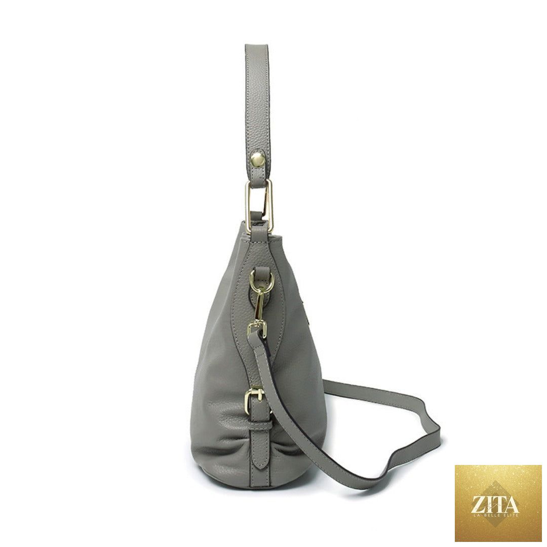 Elegant genuine leather handbag by SHOMICOBOUTIQUE featuring a stylish hobo and crossbody tote design in soft leather.