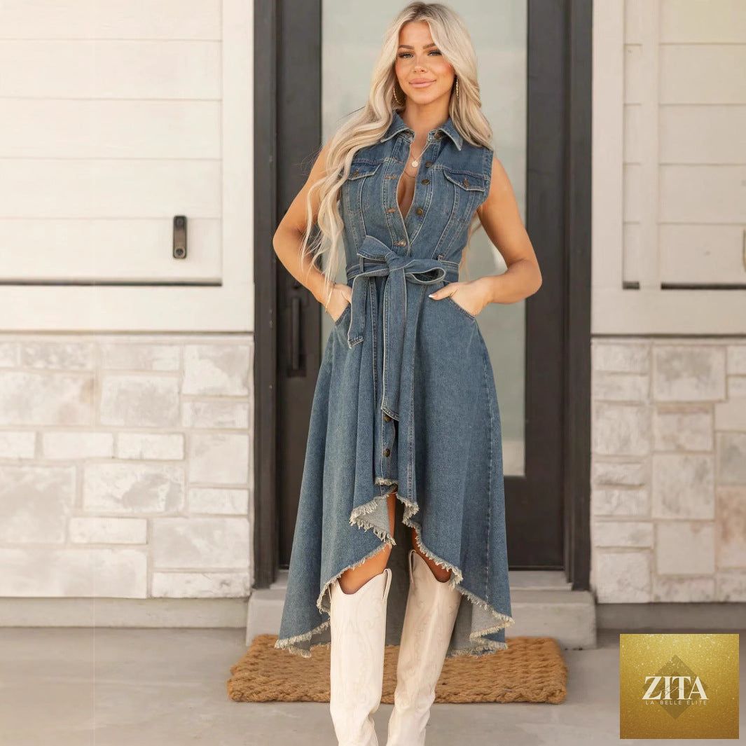 Women's sleeveless denim midi dress with irregular hem and button-front detail by FitiqueFit, shown on a model.