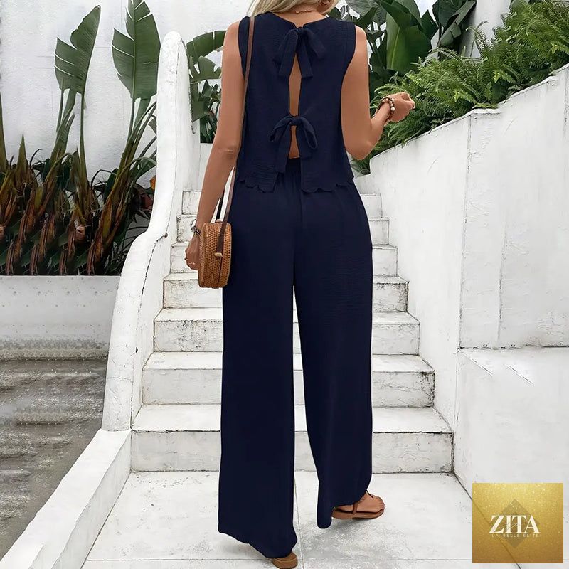 FitiqueFit elegant 2-piece matching casualwear set with sleeveless crop top and wide-leg pants, displayed on a model.