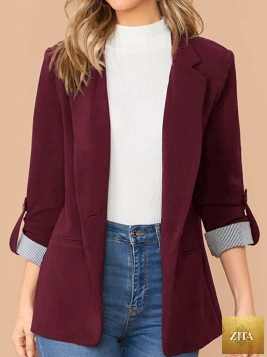 SITRA lapel collar blazer with roll-tab sleeves, tailored fit, and classic design, shown on a model.