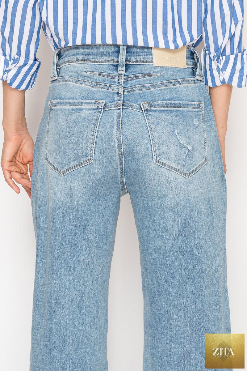 Artemis Vintage Isabella Corset Ultra High Rise Modern Wide Jeans displayed on a model, showcasing trendy denim style.