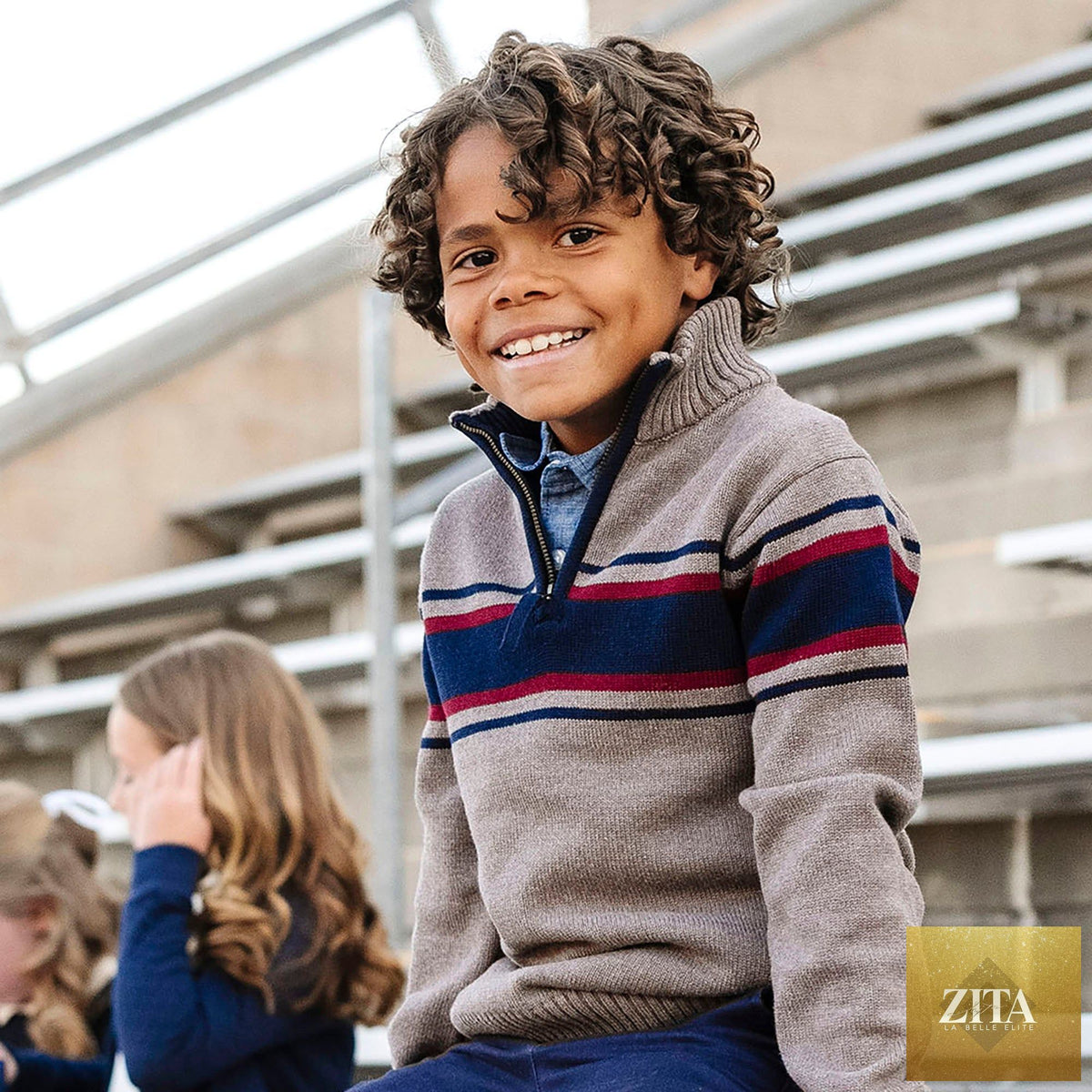 Hope & Henry organic half zip sweater, showing a cozy, light-colored knit sweater worn casually in a lifestyle setting.
