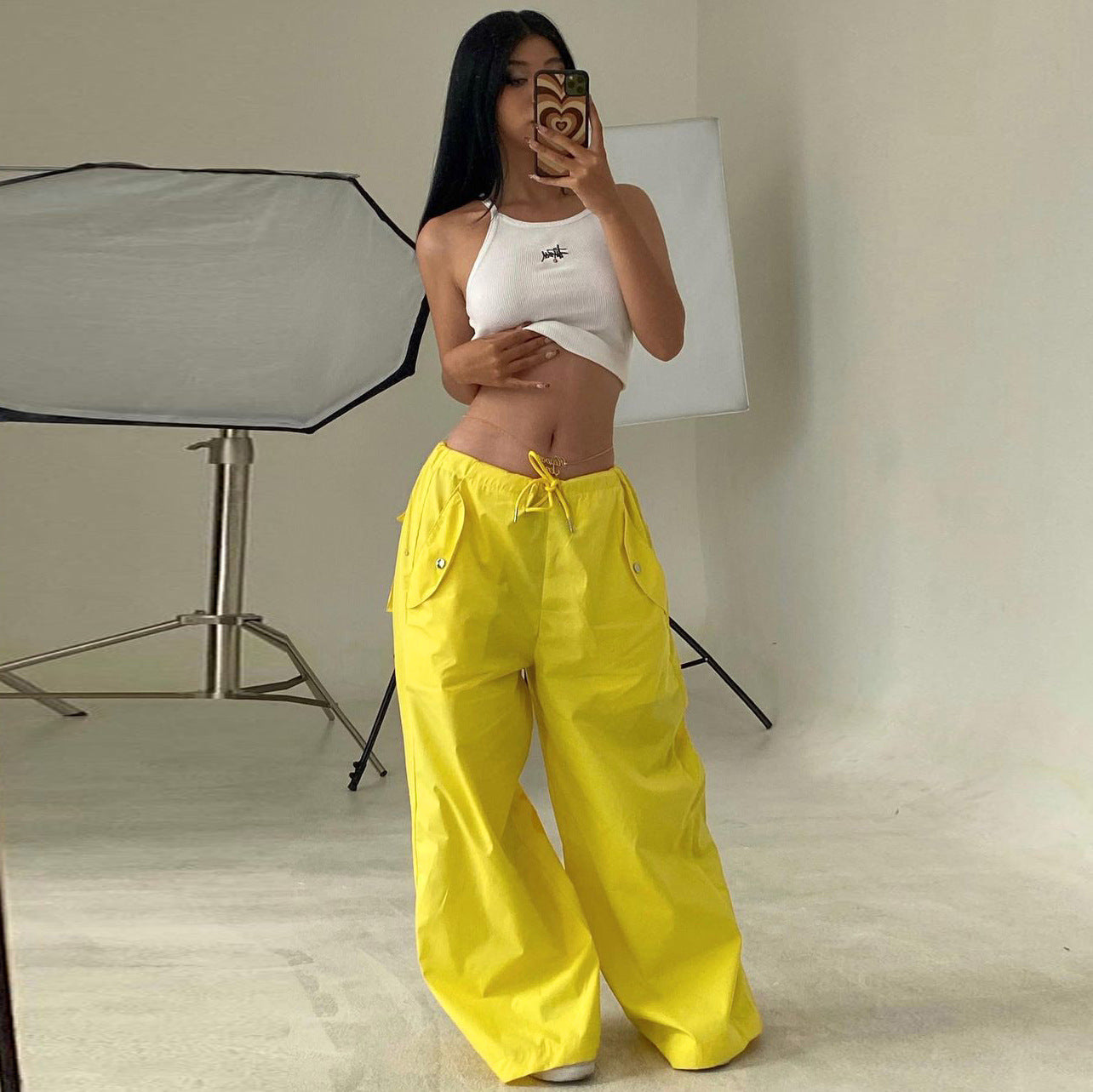 Women's high-waist lace-up straight-leg cargo pants by FitiqueFit, featuring a loose fit and casual style, shown in the image.