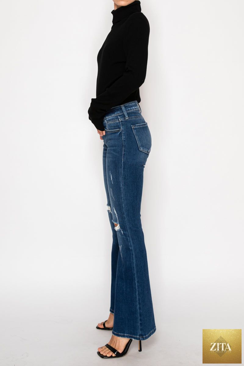 Artemis Vintage Margaret low rise stretch vintage flare jeans for women, available in regular and plus sizes, shown on a model.