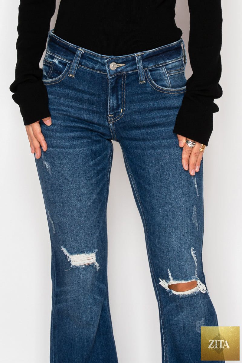 Artemis Vintage Margaret low rise stretch vintage flare jeans in classic denim, shown in a natural pose.