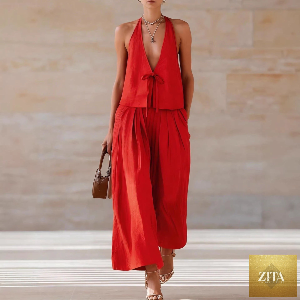 Women's sleeveless vest and wide-leg pants casualwear set by Zita La Belle Elite, featuring lace-up details and comfortable fit.