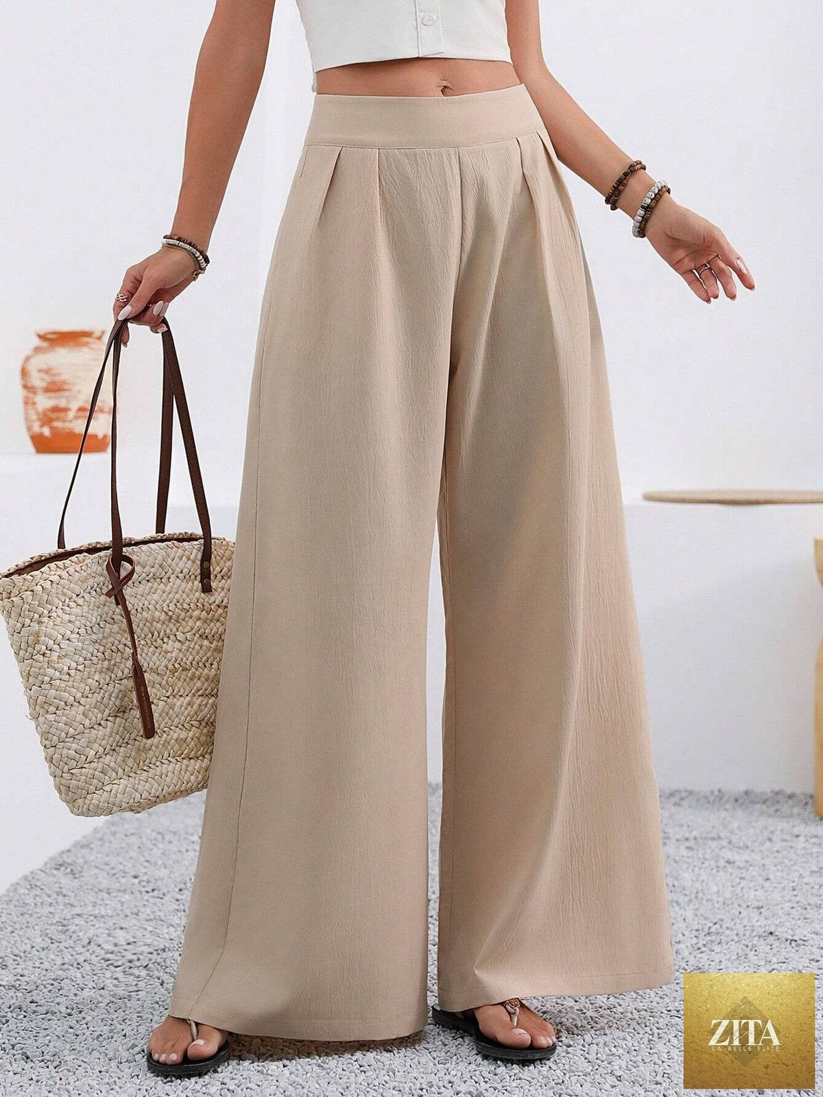 Women's high-waist wide-leg trousers with pockets by Zita La Belle Elite, full length, styled casually on a model.