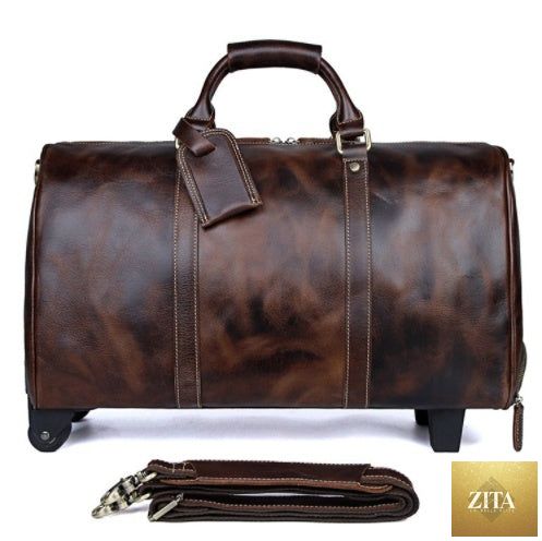 Large capacity cowhide trolley travel bag by Social Buzz eSIMs with sturdy wheels and leather handles for easy travel.