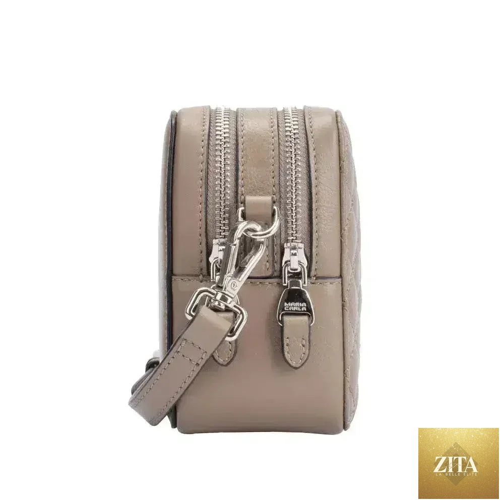 Elegant small leather handbag by Femstylo featuring smooth texture, perfect for women's fashion and luxury styling.