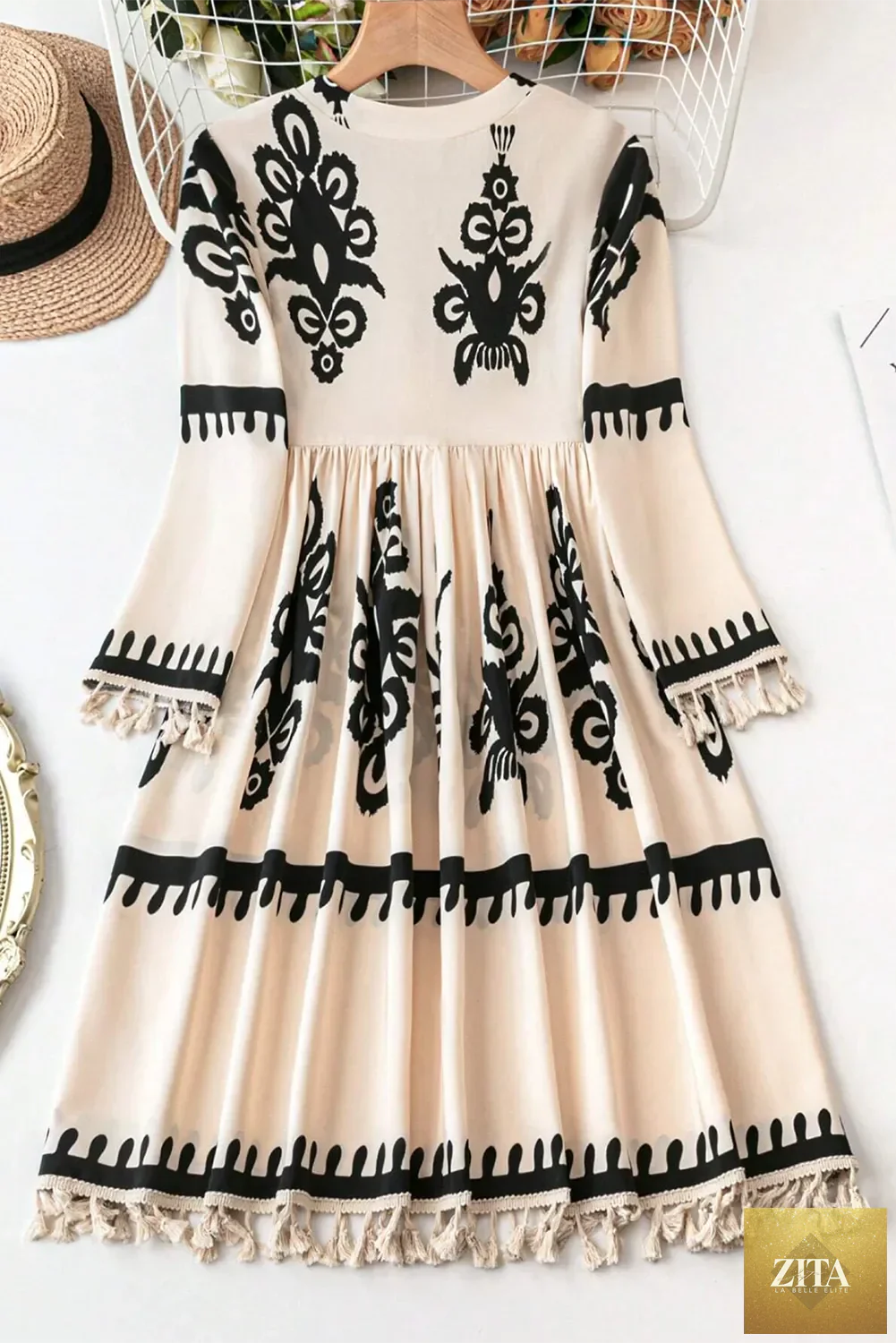 Tassel printed three-quarter sleeve mini dress by Shopiebay featuring colorful patterns and a stylish, flowy silhouette.