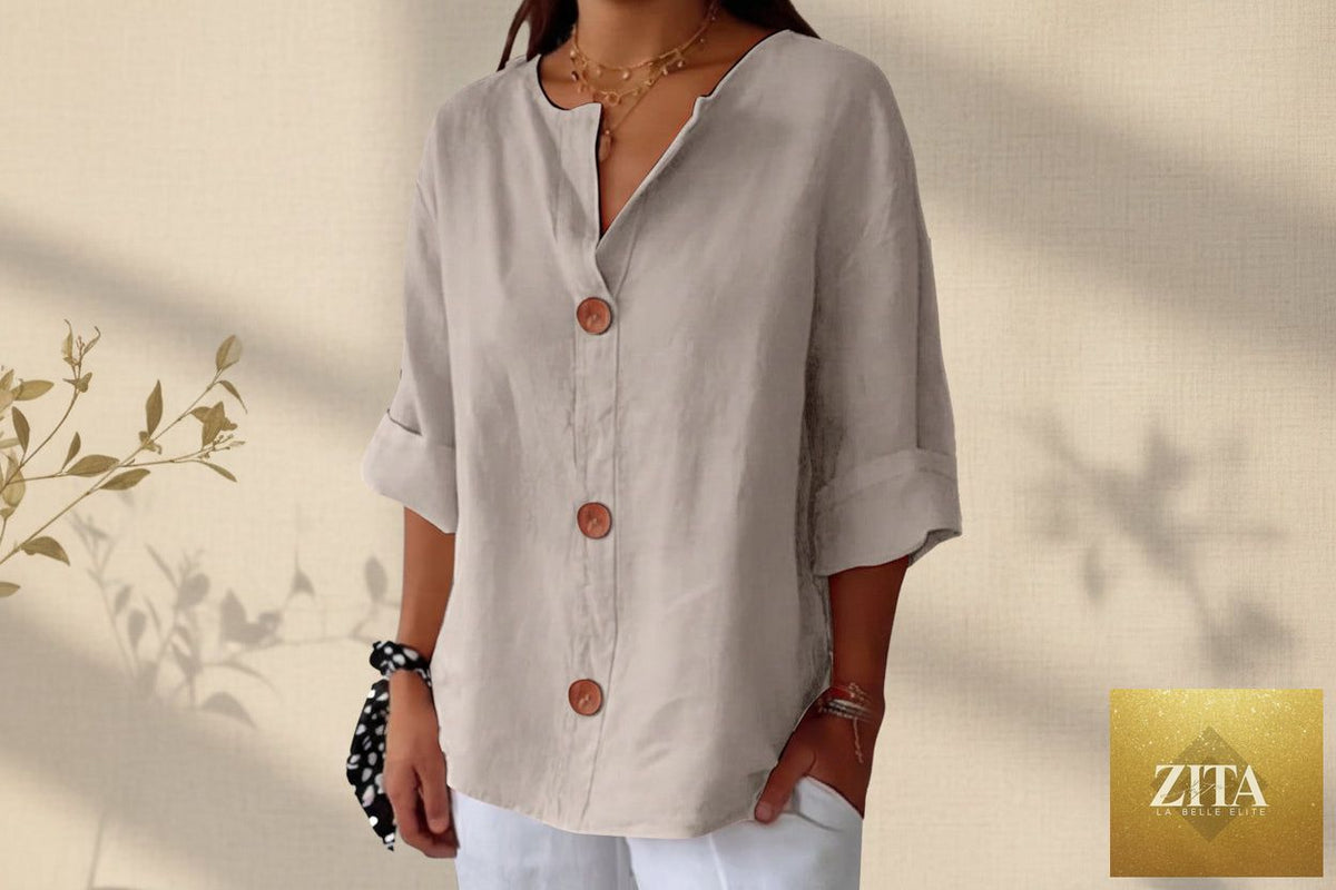 Women's V-neck cotton linen blouse with button details, casualwear by FitiqueFit, shown in a relaxed fit on a model.