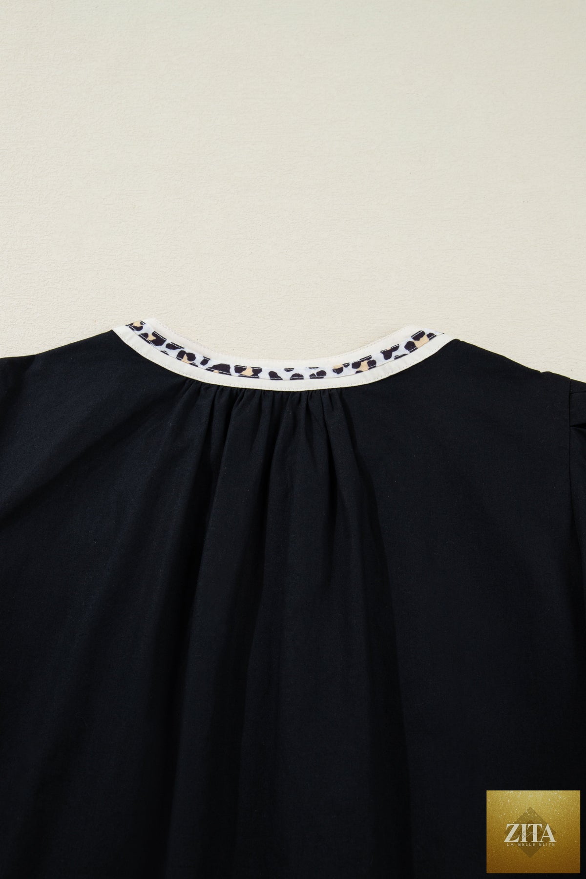 Black leopard trim notched neck short puff sleeve shift mini dress from Wild and Free Boutique, stylish and trendy for casual wear.