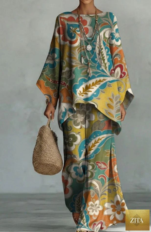 Women's colorful printed casual dress by Zita La Belle Elite, flowing fabric with vibrant floral and abstract patterns.