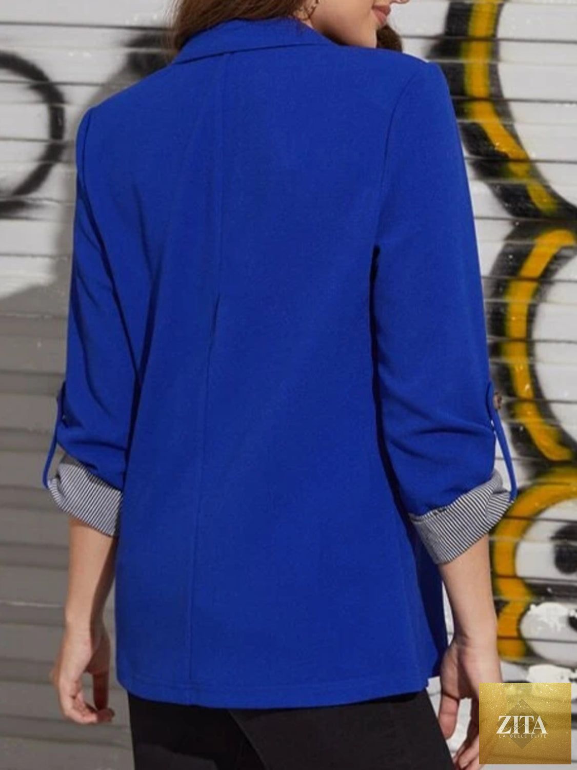 SITRA lapel collar blazer with roll-tab sleeves, tailored fit, and classic design, shown in a professional style image.