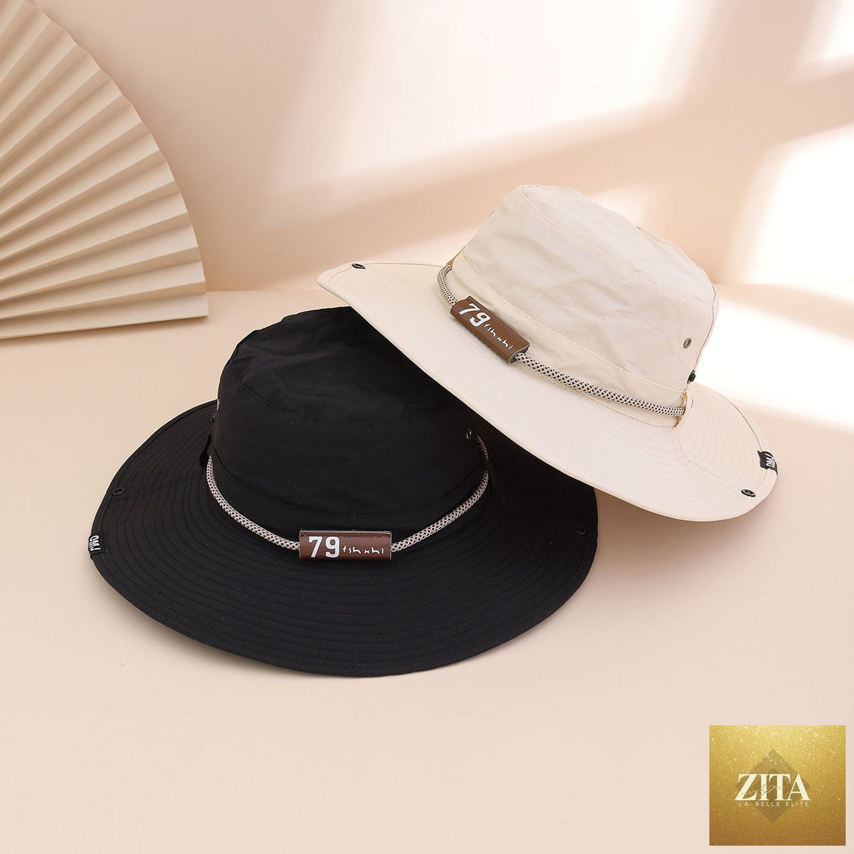 Wide-brim leather patch fisherman hat by Zita La Belle Elite, designed for sun protection and outdoor wear.