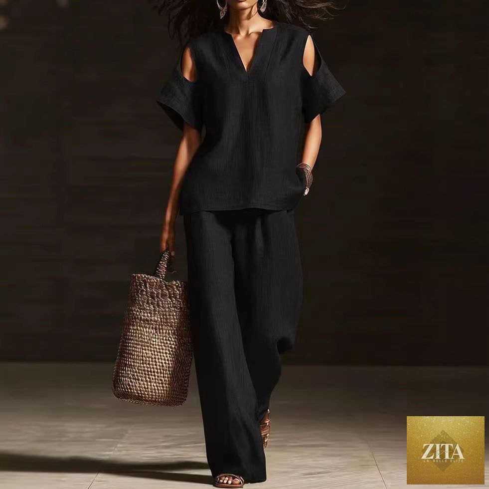 Zita La Belle Elite two-piece V-neck short sleeve top and straight-leg pants set with ripped details and pockets in solid color.