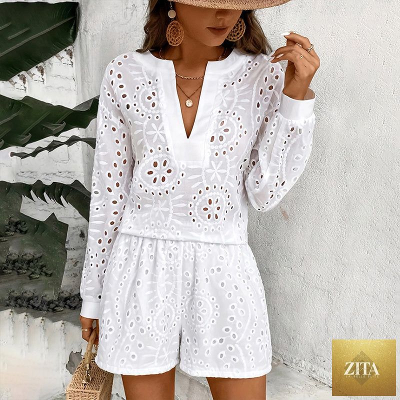 Women's eyelet embroidery V-neck long sleeve top and matching shorts two-piece set by MERIDGE, displayed on a hanger.