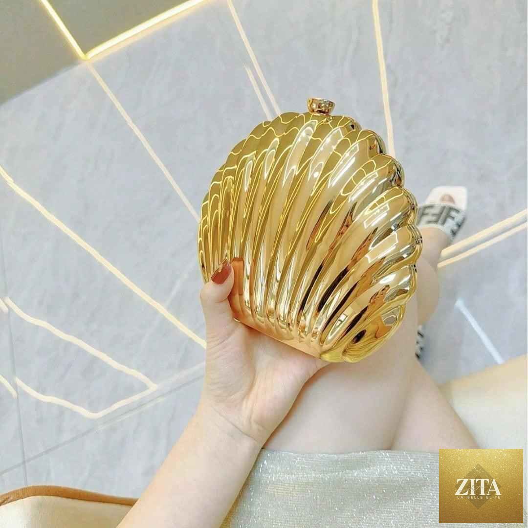 Elegant women's sparkly seashell acrylic clutch purse with metallic finish, perfect for evening parties and prom events.