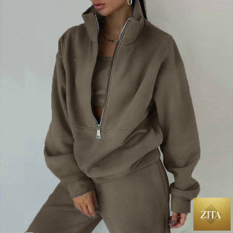 Women’s fleece two-piece set by MERIDGE featuring a full-zip cropped sweatshirt and wide-leg pants for a casual, comfortable look.