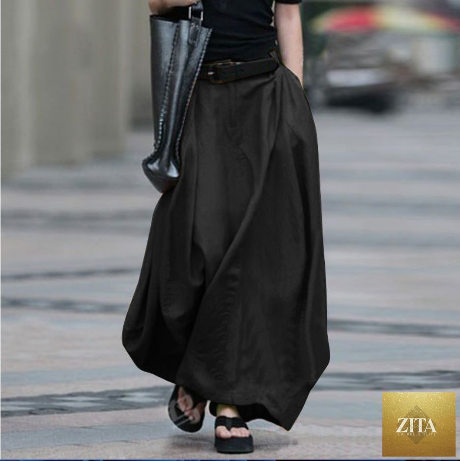Women's high-waist flared maxi skirt in solid cotton linen with pockets, by FitiqueFit, displayed in a natural pose.