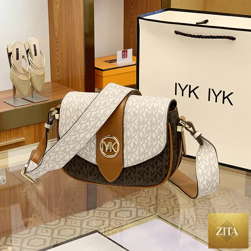 Leather saddle bag for women by Trendy Attic Store01, stylish purse with adjustable strap and classic design.