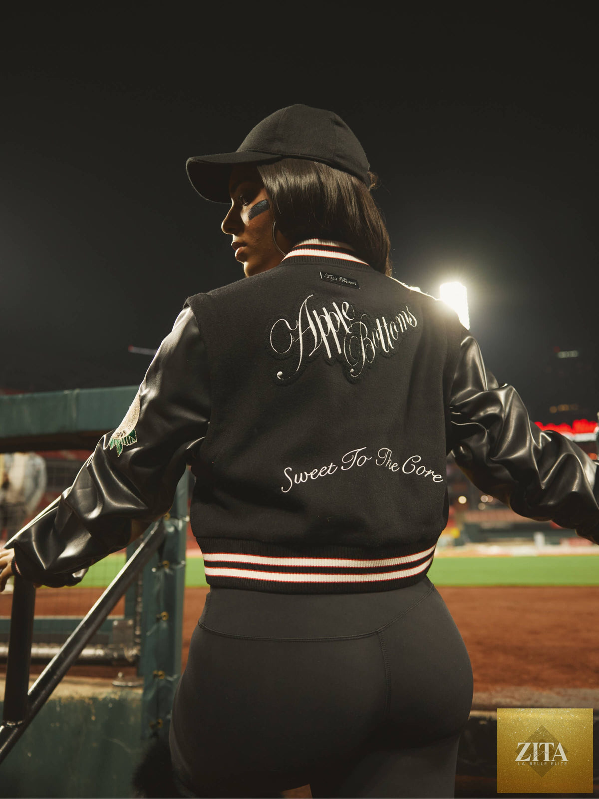 Apple Bottom Jeans varsity jacket featuring a stylish design, with a classic collar and logo details, perfect for casual wear.