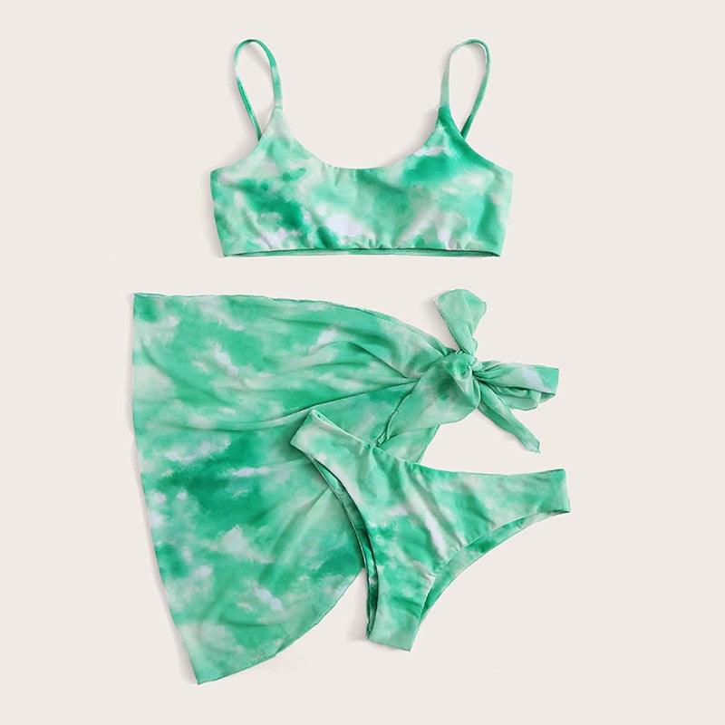 Stevvex 3-piece women’s bikini set with high-cut bottoms, halter top, wrap skirt, lace-up details, and backless design.