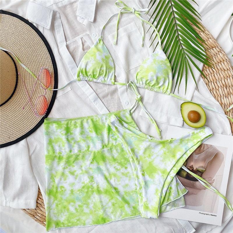 Stevvex 3-piece women’s bikini set with high-cut style, halter top, wrap skirt, lace-up strings, backless design, perfect for beachwear.