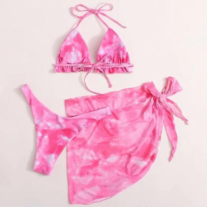 Stevvex 3-piece women’s bikini set with high-cut design, halter top, wrap skirt, and lace-up strings for stylish swimwear.