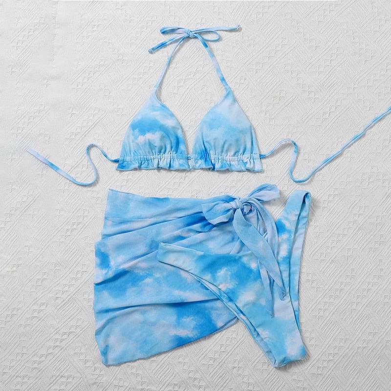 Stevvex 3-piece women's bikini set with high-cut design, halter top, wrap skirt, lace-up details, and backless triangle style.