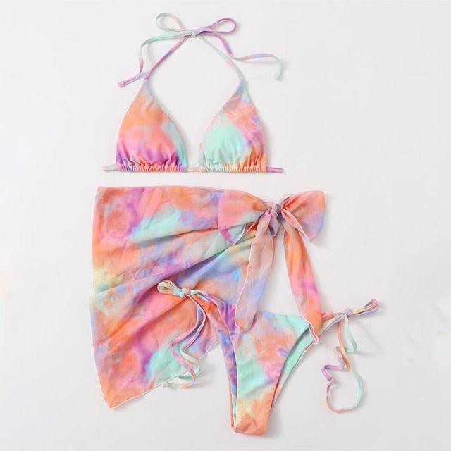 Stevvex 3-piece women's bikini with high-cut design, halter neck, wrap skirt, lace-up strings, and backless triangle style.
