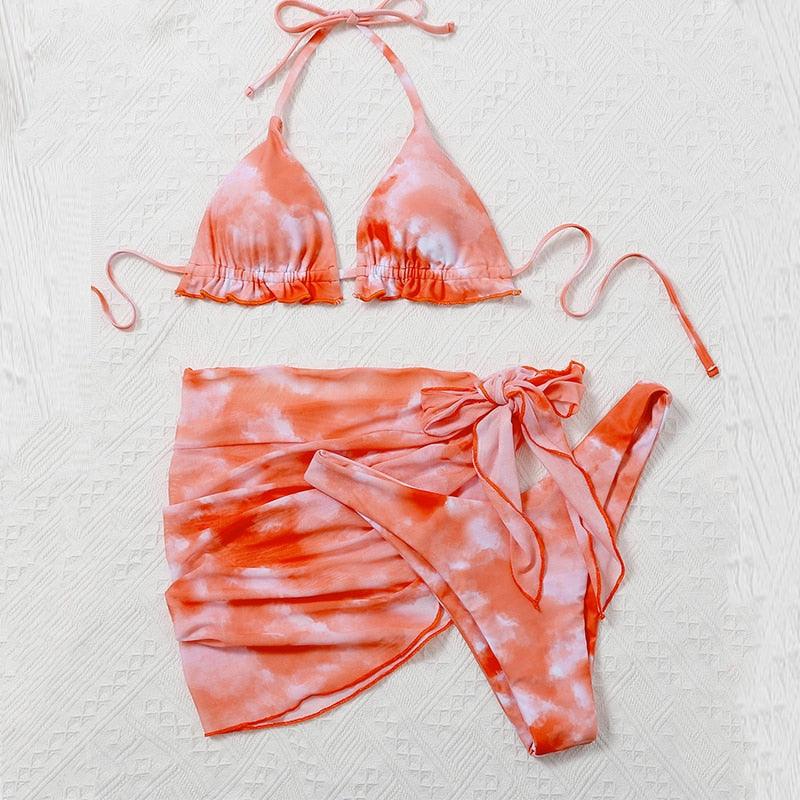 Stevvex 3-piece women's bikini set with high cut, halter top, wrap skirt, lace-up details, and backless bathing suit for women.