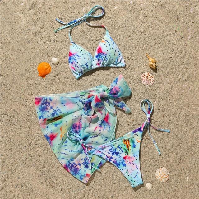 Stevvex 3-piece women's bikini set with high-cut design, halter top, wrap skirt, lace-up strings, and triangle backless bathing suit.