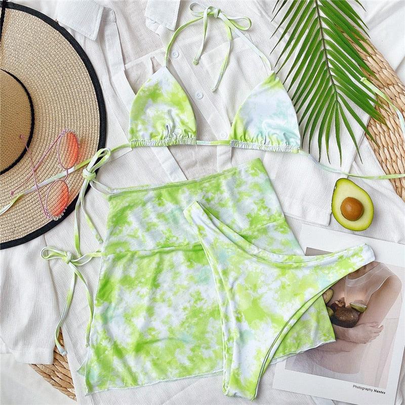Stevvex 3-piece women's high-cut bikini set with halter top, wrap skirt, lace-up details, and backless triangle design.