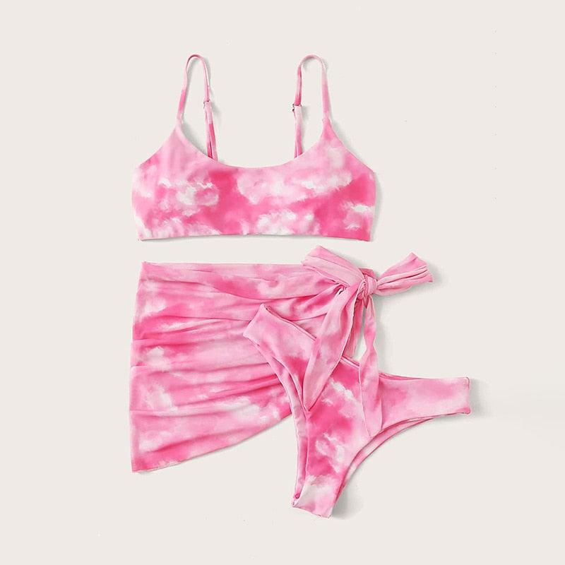 Stevvex 3-piece women's bikini set with high-cut design, halter top, wrap skirt, lace-up details, and backless bathing suit.