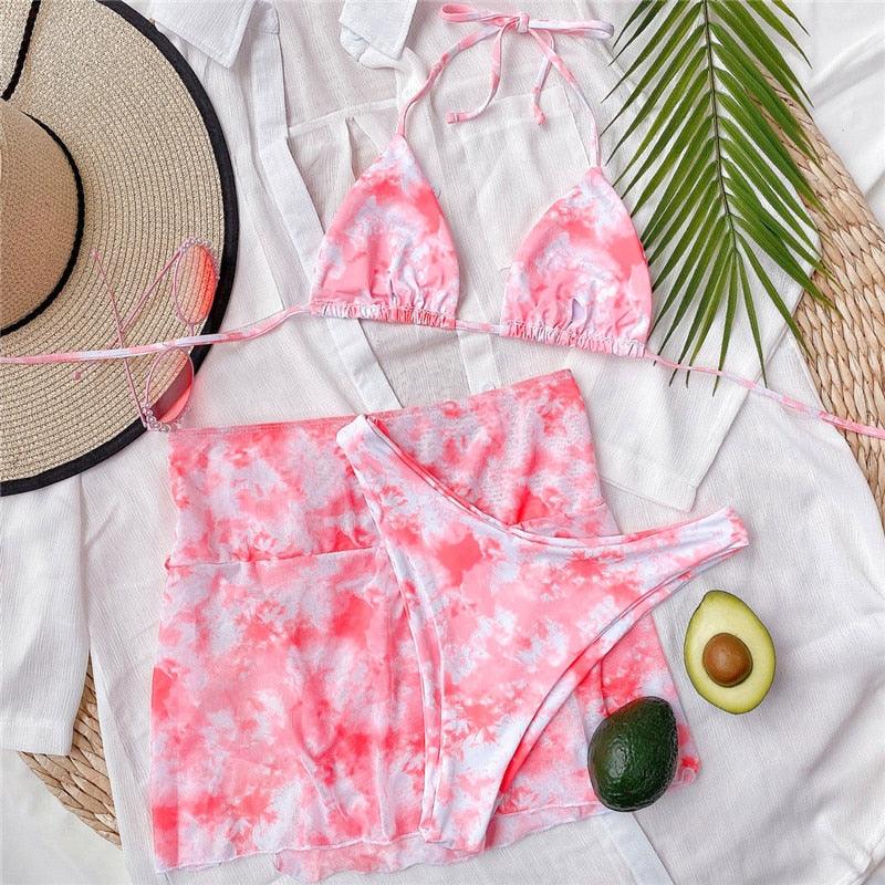 Stevvex 3-piece women's bikini set with high-cut style, halter top, wrap skirt, lace-up details, and triangle backless design.