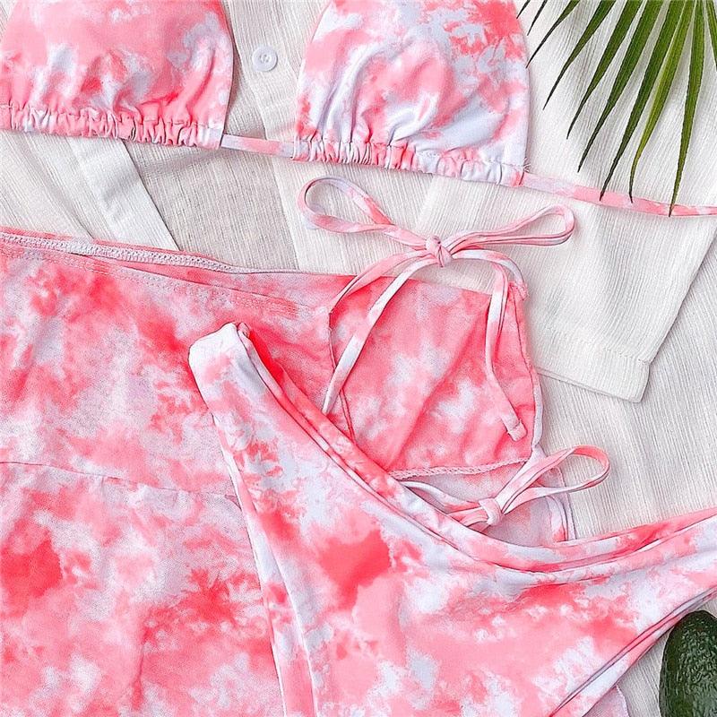 Stevvex 3-piece women's bikini set with high-cut style, halter top, wrap skirt, lace-up details, and backless bathing suit design.