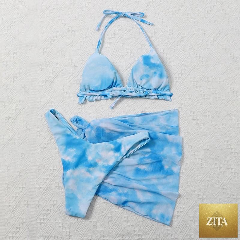 Stevvex 3-piece women's bikini set featuring high-cut swimsuit, halter top, wrap skirt, lace-up details, and backless design.