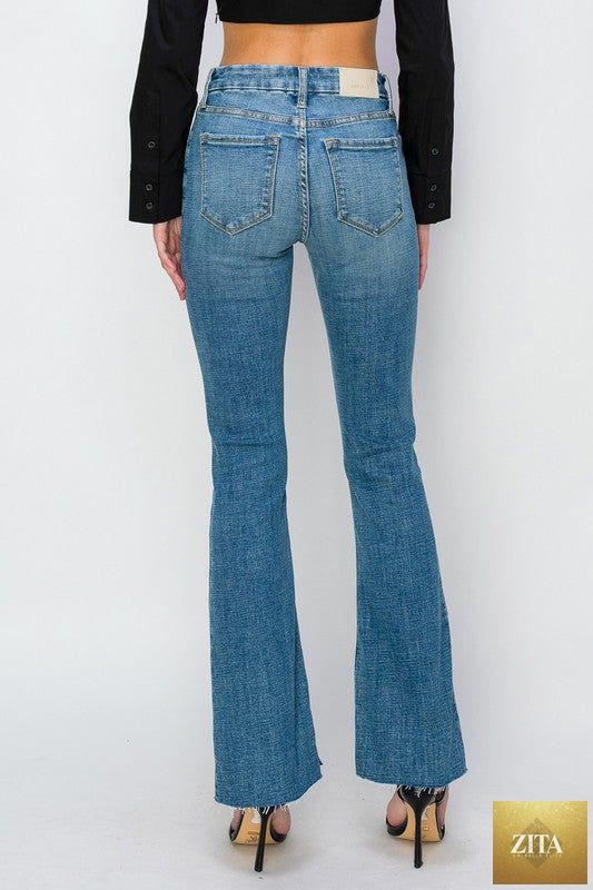 Artemis Vintage paisley high-rise flare jeans in regular and plus sizes, showing the detailed paisley pattern and wide flare leg.