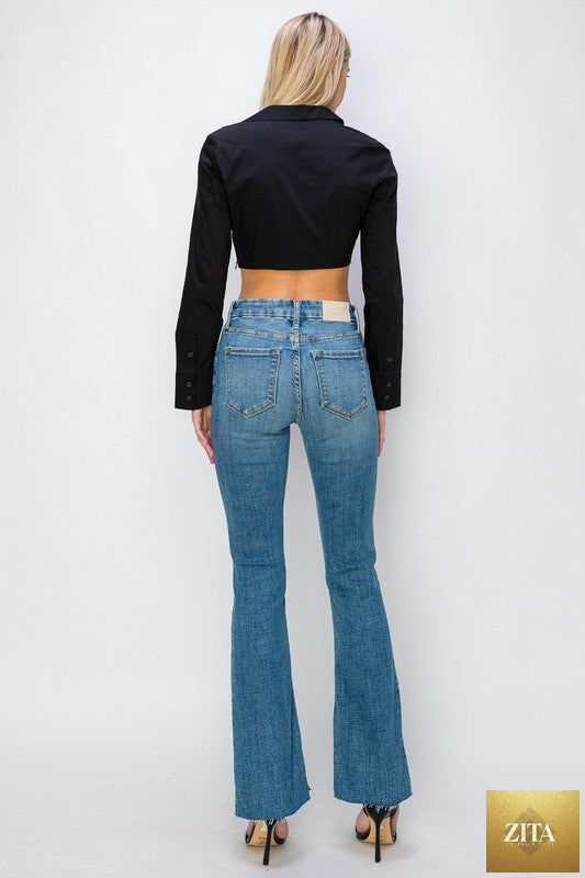 Artemis Vintage paisley high-rise flare jeans in regular and plus sizes, showing the detailed paisley pattern and wide flare leg silhouette.
