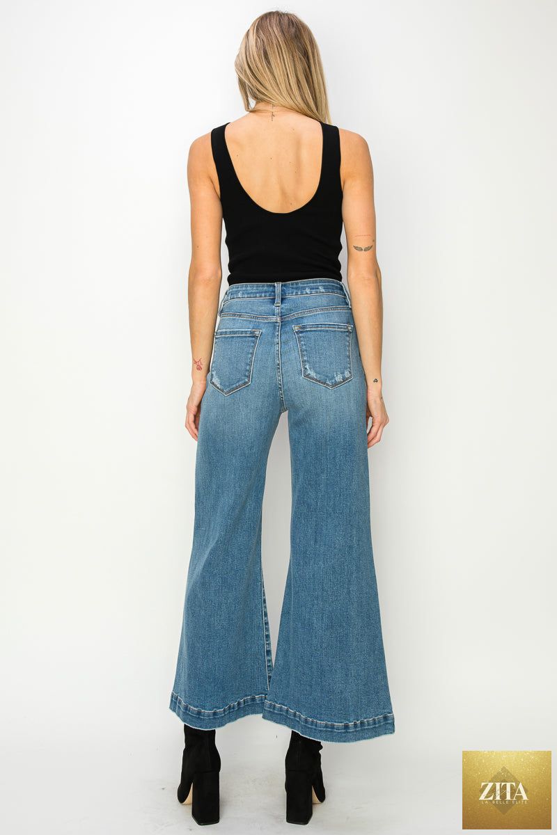 Artemis Vintage Noa high-rise crop palazzo jeans with wide legs and distressed details, styled with a casual top and sneakers.