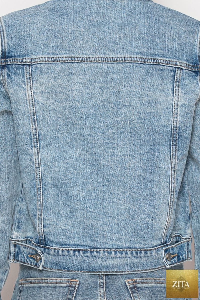 Artemis Vintage Michelle Classic Denim Jacket displayed on a hanger, featuring a button-front design and classic blue denim fabric.